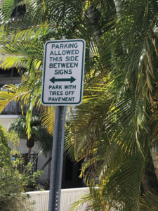 Street parking signs for Bean Point Beach on Ana Maria Island Florida